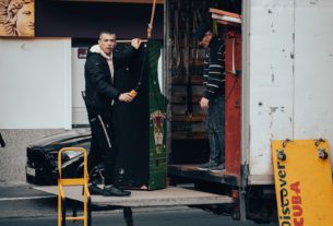 a person standing in a doorway of a building