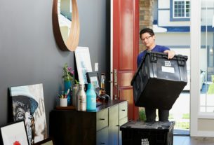 man in blue polo shirt sitting on chair