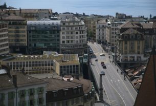cars on road near buildings during daytime