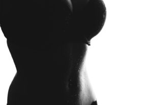 grayscale photo of sweating woman